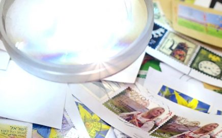 stamp collection and magnifying glass