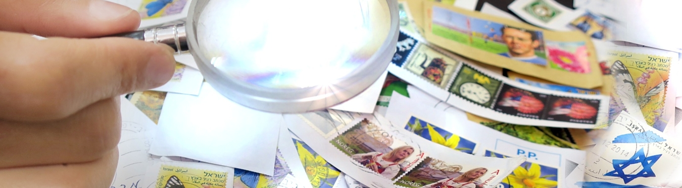 stamp collection and magnifying glass