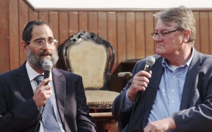 two men with microphones in their hands