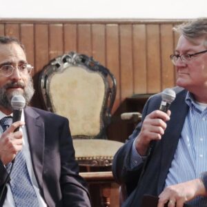 two men with microphones in their hands