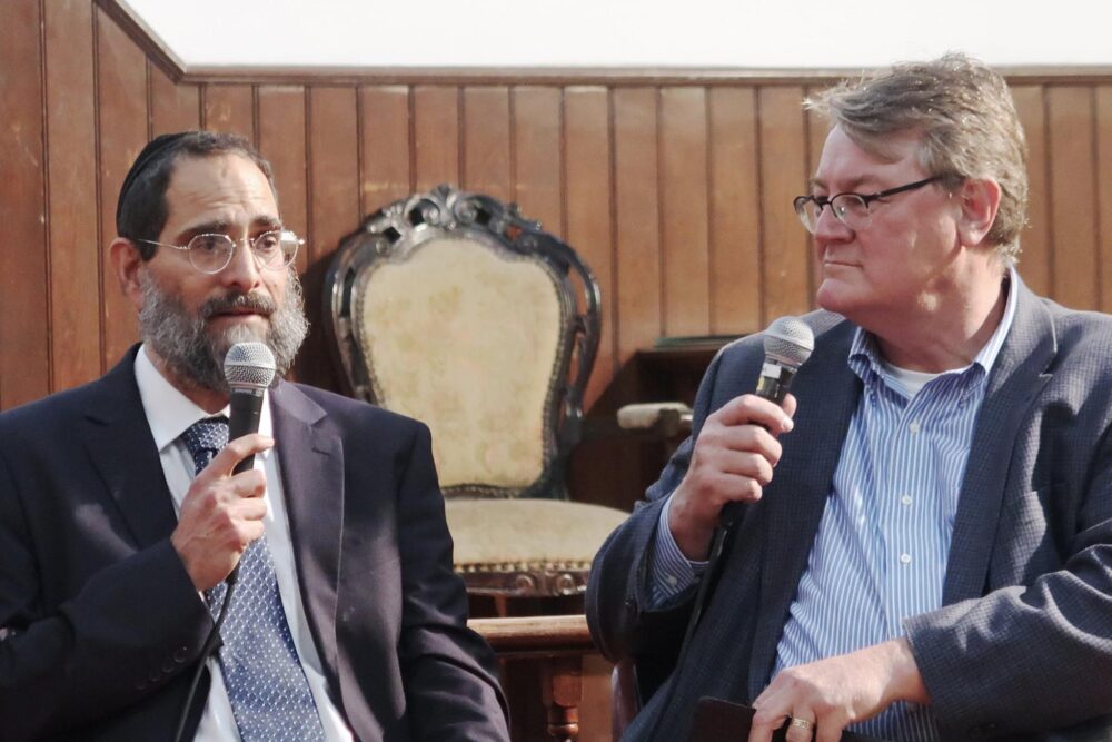 two men with microphones in their hands