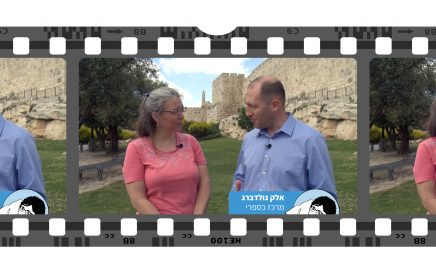 man and woman standing in front of Jerusalem's Old City walls