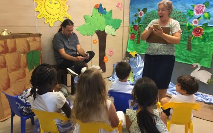 teacher teaching children in Shabbat School