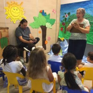 teacher teaching children in Shabbat School