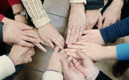 circle of women's hands