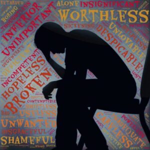 person sitting on a chair and thinking, with words surrounding like, like "hopeless" and "broken"