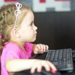 Little girl in front of computer