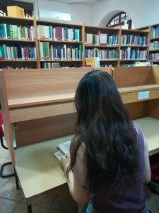 A girl reading in library